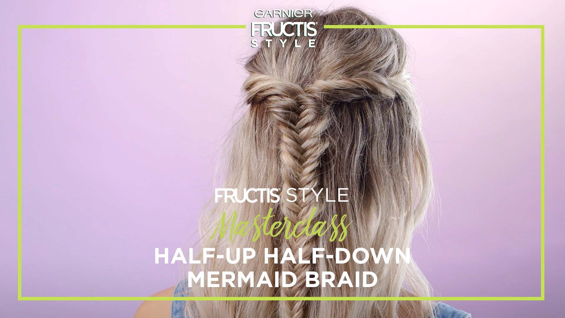 The back of a girl's head displaying the Half-Up Half-Down Mermaid Braid hairstyle.